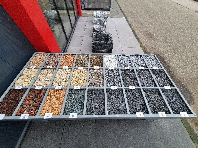 Variety of stone samples at the garden centre such as different types of basalt, granite, limestone, lava stone, marble, quartz, and slate.