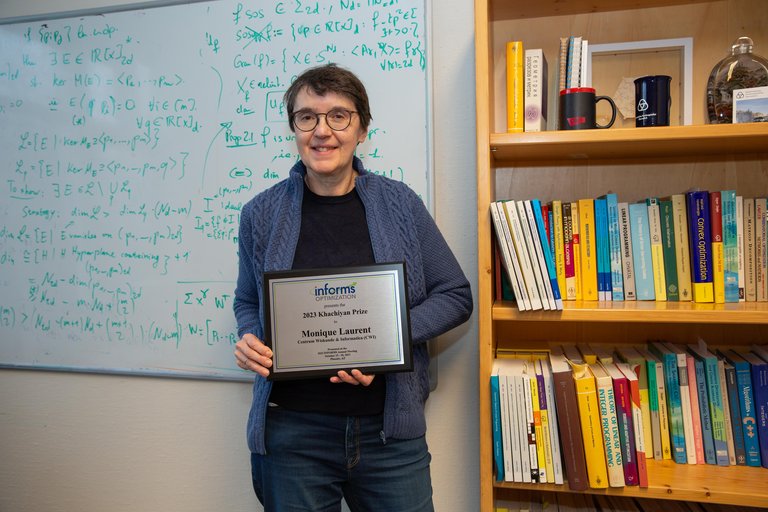 Monique Laurent (CWI and UvT) with the 2023 INFORMS Khachiyan Prize certificate. Picture: CWI.