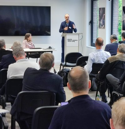 ERCIM Visionary Event - Liviu Stirbat (standing), head of the unit AI and Science at the DG Research and Innovation of the European Commission, and  Cecile Huet, head of unit AI and Robotics at the DG Connect (sitting in front).