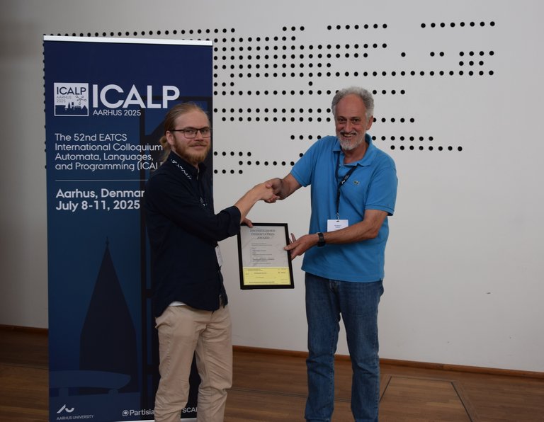 Joakim Blikstad, receiving the 2025 EATCS Distinguished Dissertation Award at ICALP 2025 in Denmark.