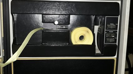 Rolled-up punched tape in the PDP-11. Picture: Geert Rolf.