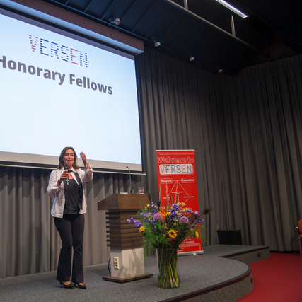 Chair of SEN symposium announcing award