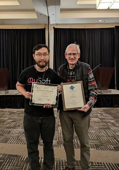Junqiao (Randy) Lin together with László Babai, one of the pioneers of this research field, who won the STOC Test of Time award.
