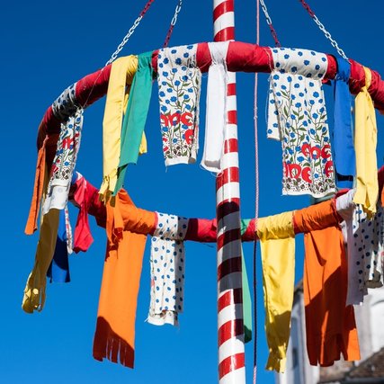 Colorful maypole decorations celebrating European spring festivals and the symbolic farewell to winter