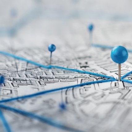 Location marking with a pin on a map with routes.